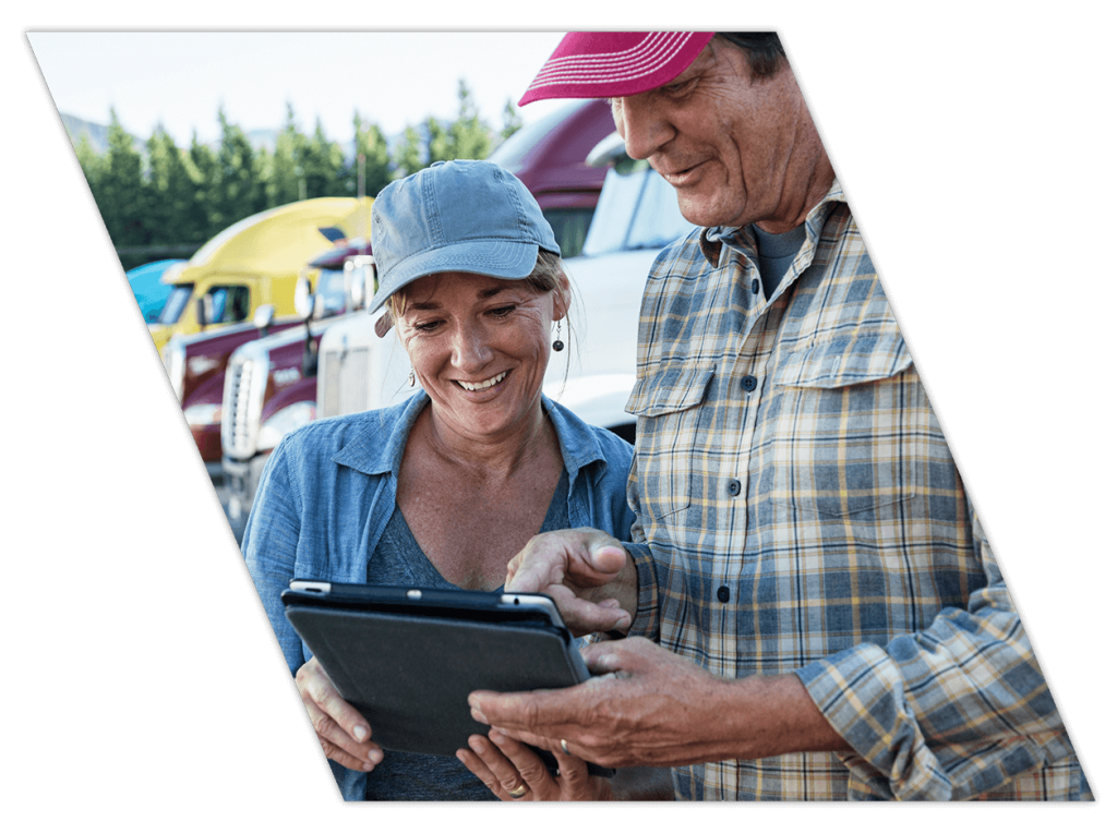 Truck driving students looking at training results