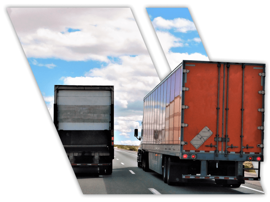 Back view of trucks driving on highway