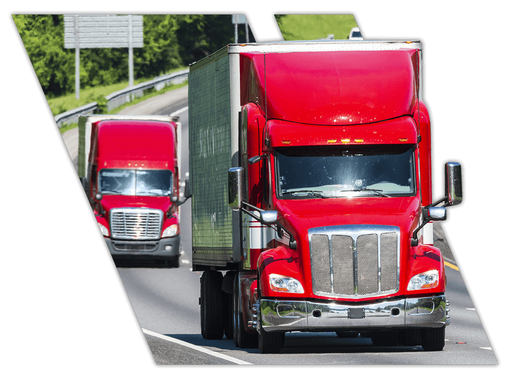Big rig red trucks on interstate in Natchez