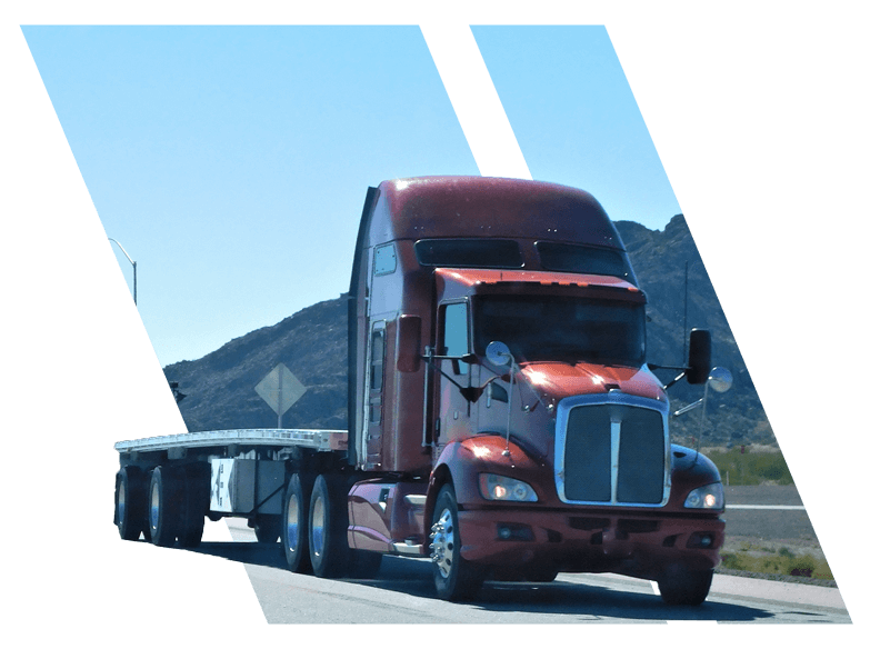 red flatbed truck driving to commercial driving school in baton rouge