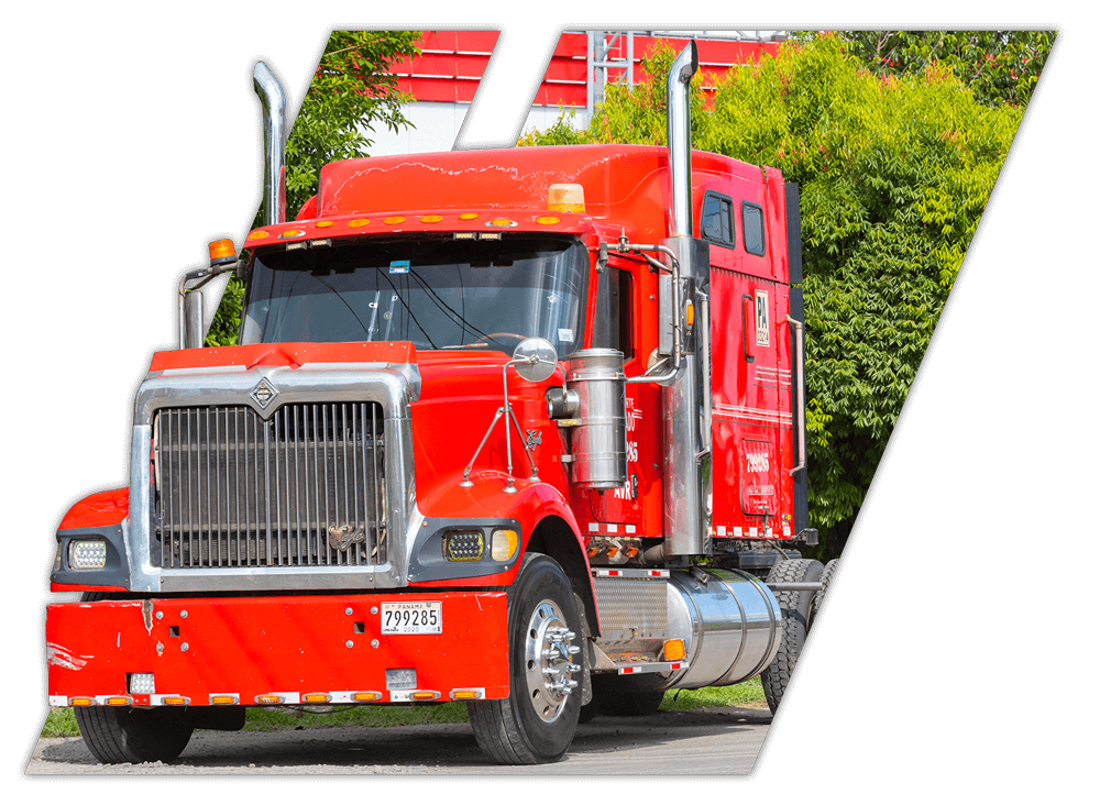 Red truck driving at truck driving school in Mississippi