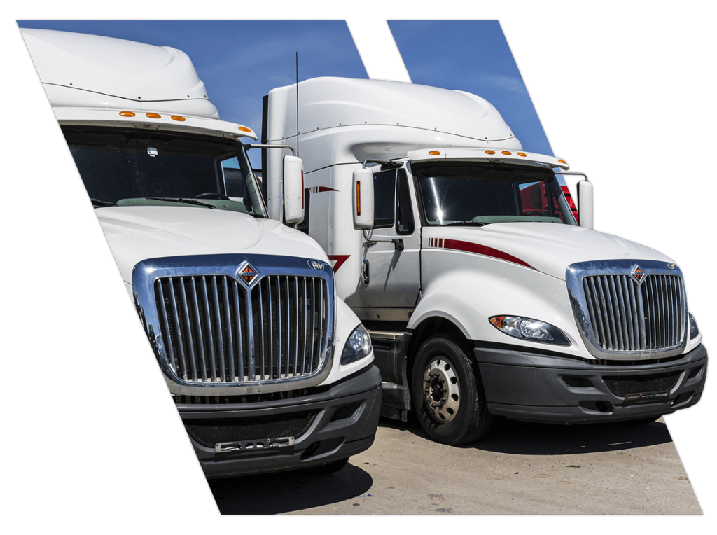 Two white trucks ready for CDL contract training in Alabama