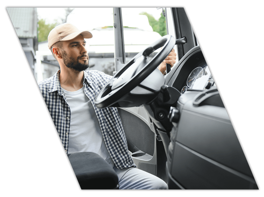 Driver entering his truck for company CDL training in Texas